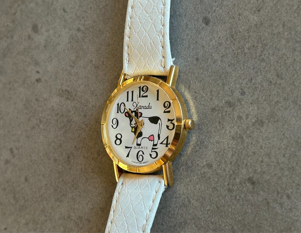 Xanadu Quartz Black & White Cow Watch White Leather Strap Gold Tone Case Working